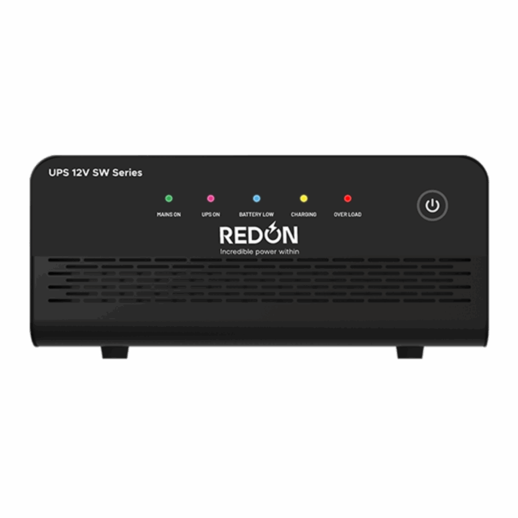 Front view of a black lithium battery with five LED indicators labeled: 'Mains On,' 'UPS On,' 'Battery Low,' 'Charging,' and 'Overload.' The power button is on the right. Brand name 'REDON' is displayed centrally